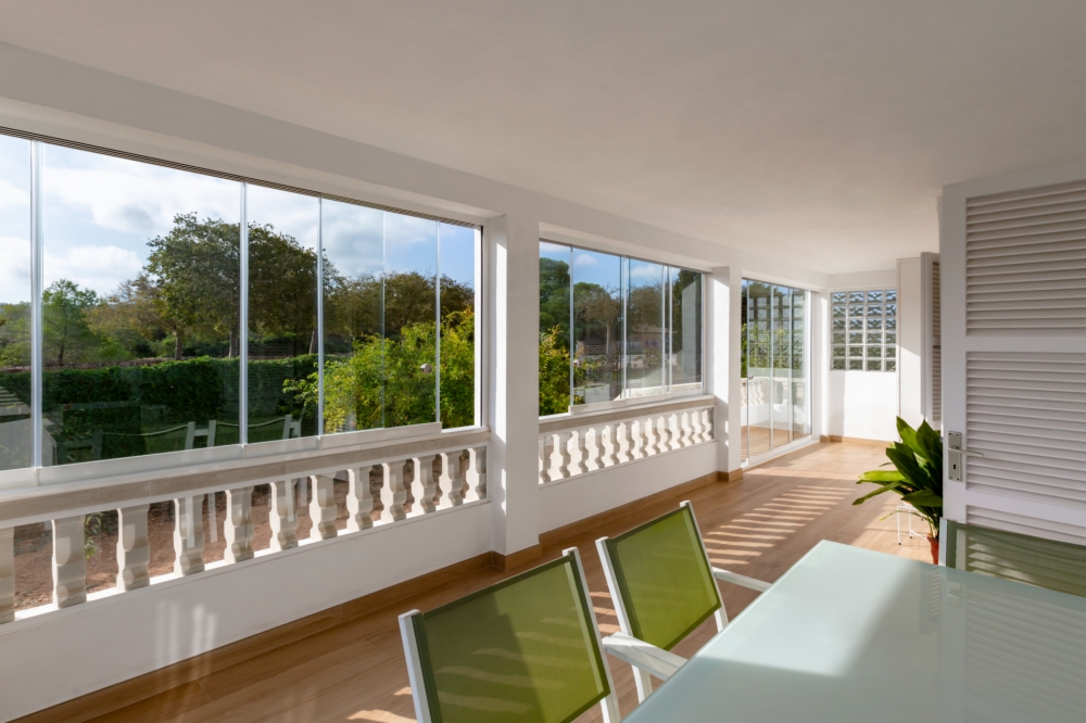 Bright and sheltered terraces with Astron Glass Curtains